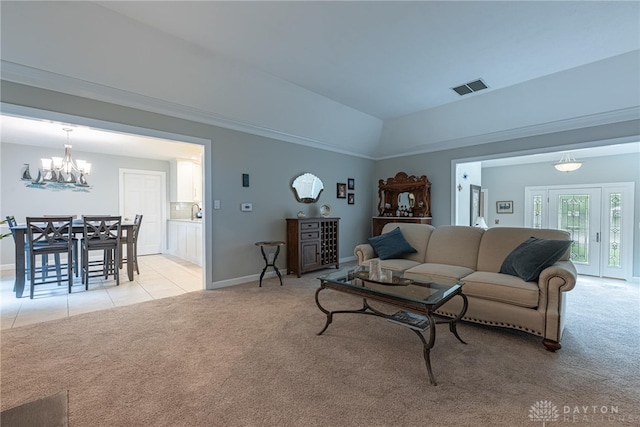 5010 Rhine Way, Centerville, OH 45458 - living room featuring light colored carpet, vaulted ceiling, a chandelier, and light tile patterned flooring