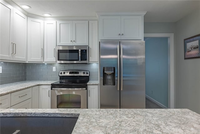 5010 Rhine Way, Centerville, OH 45458 - kitchen with stainless steel appliances, white cabinets, decorative backsplash, light stone countertops, and recessed lighting