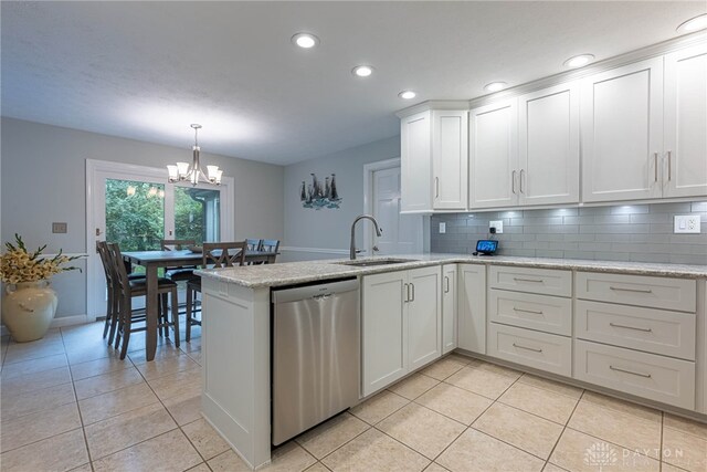 5010 Rhine Way, Centerville, OH 45458 - kitchen with dishwasher, light tile patterned flooring, white cabinetry, a chandelier, and recessed lighting