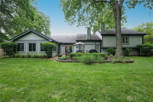 5010 Rhine Way, Centerville, OH 45458 - rear view of property featuring a lawn and a shingled roof