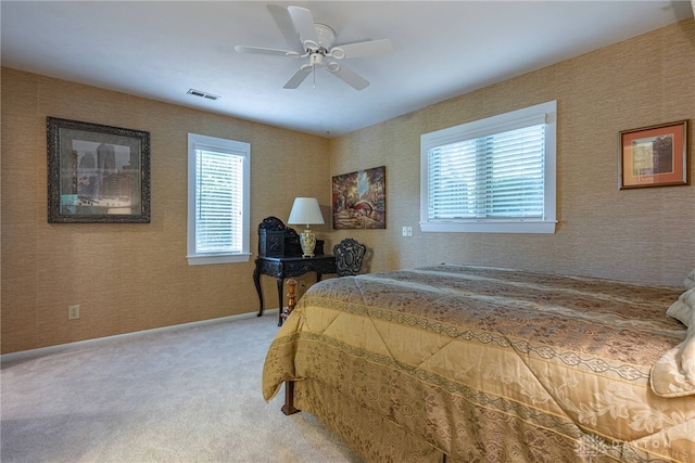 5010 Rhine Way, Centerville, OH 45458 - bedroom featuring light colored carpet, a ceiling fan, and wallpapered walls