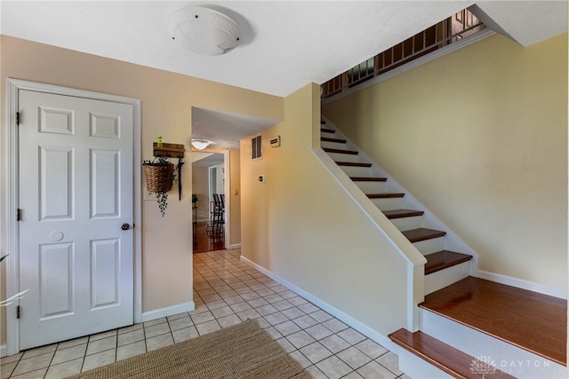 9031 S Normandy Ln, Washington Twp, OH 45458 - stairway with tile patterned floors and baseboards