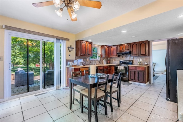 9031 S Normandy Ln, Washington Twp, OH 45458 - dining area featuring a ceiling fan, light tile patterned floors, recessed lighting, and a textured ceiling