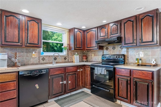 9031 S Normandy Ln, Washington Twp, OH 45458 - kitchen featuring black appliances, under cabinet range hood, light countertops, decorative backsplash, and a textured ceiling