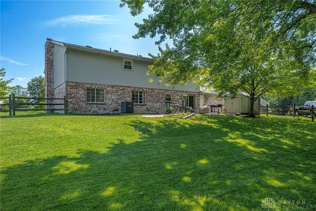 9031 S Normandy Ln, Washington Twp, OH 45458 - rear view of property featuring a chimney
