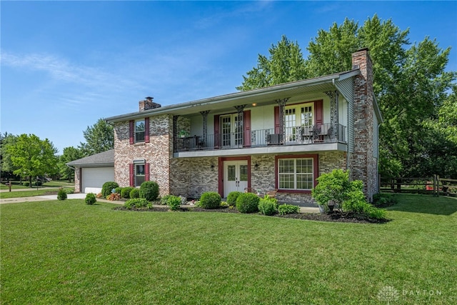 9031 S Normandy Ln, Washington Twp, OH 45458 - view of front facade with french doors, a chimney, a garage, concrete driveway, and a balcony