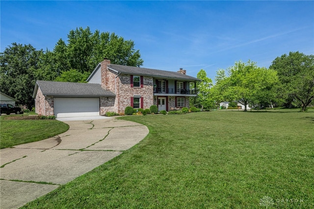 9031 S Normandy Ln, Washington Twp, OH 45458 - colonial inspired home featuring a balcony, a chimney, a garage, concrete driveway, and a front yard