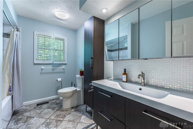 9031 S Normandy Ln, Washington Twp, OH 45458 - bathroom featuring vanity, backsplash, a textured ceiling, and shower / bath combo