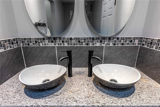 9031 S Normandy Ln, Washington Twp, OH 45458 - bathroom with a sink and decorative backsplash