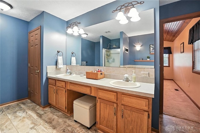 450 Overfield Pl, Troy, OH 45373 - full bath featuring double vanity, an enclosed shower, a chandelier, and backsplash