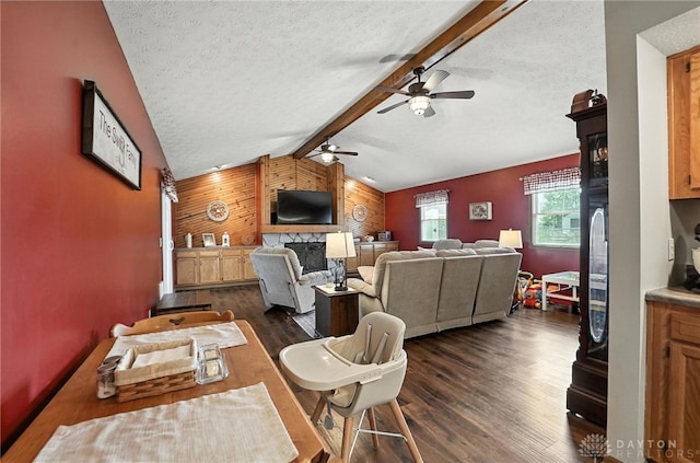 450 Overfield Pl, Troy, OH 45373 - living room featuring a ceiling fan, dark wood-type flooring, wood walls, and a textured ceiling