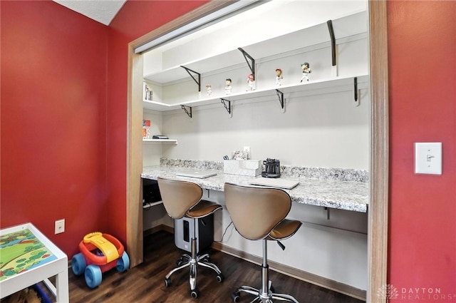 450 Overfield Pl, Troy, OH 45373 - office area featuring built in desk and dark wood-style flooring