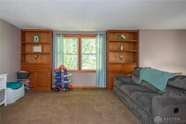 4913 Bittern Ct, Huber Heights, OH 45424 - living room featuring carpet flooring and baseboards