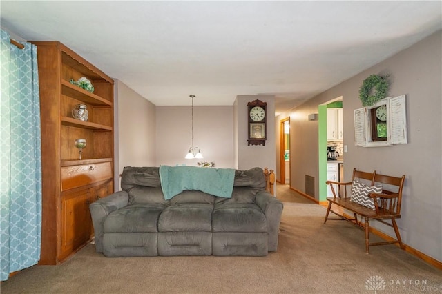 4913 Bittern Ct, Huber Heights, OH 45424 - living room featuring light colored carpet and baseboards