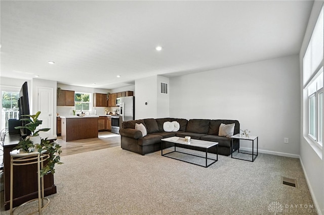 55 Spicewood Dr, Amelia, OH 45102 - living room featuring healthy amount of natural light, light carpet, and recessed lighting