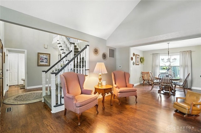 3166 Green Turtle Dr, Butler Twp, OH 45414 - sitting room featuring stairs, wood finished floors, high vaulted ceiling, and a chandelier