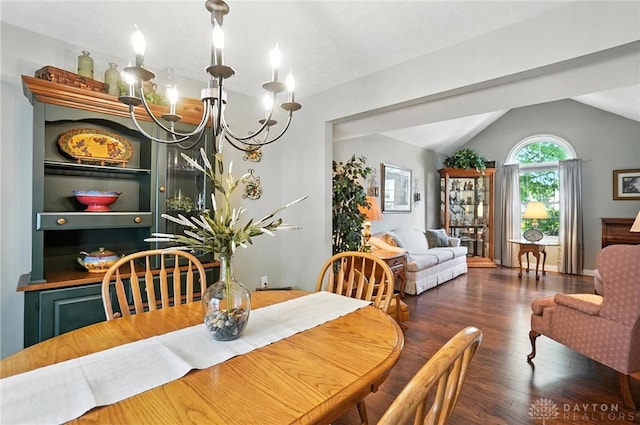 3166 Green Turtle Dr, Butler Twp, OH 45414 - dining space with a chandelier, wood finished floors, and vaulted ceiling