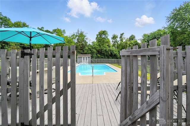 3166 Green Turtle Dr, Butler Twp, OH 45414 - view of pool with a fenced backyard, a deck, and a shed