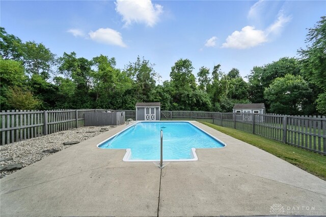 3166 Green Turtle Dr, Butler Twp, OH 45414 - view of pool with a storage shed, a patio area, and a fenced backyard