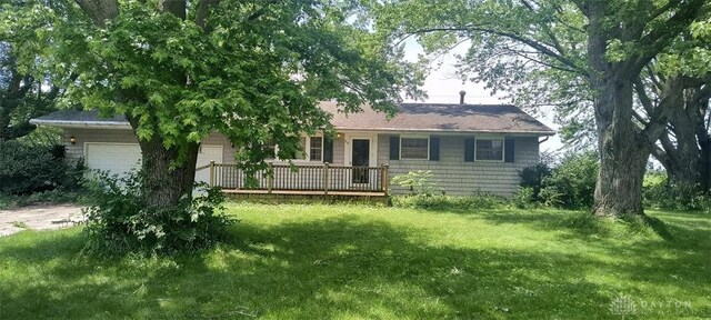 29 Elm St, Jamestown Vlg, OH 45335 - view of front of house with an attached garage, a front yard, and a deck
