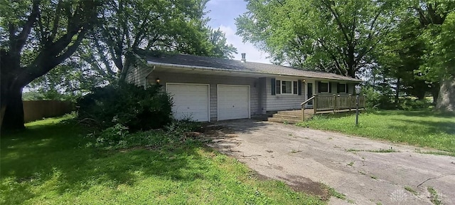 29 Elm St, Jamestown Vlg, OH 45335 - ranch-style home with an attached garage, a front yard, and asphalt driveway