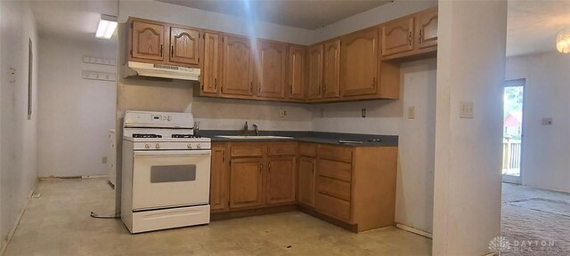 29 Elm St, Jamestown Vlg, OH 45335 - kitchen featuring white gas range, under cabinet range hood, and dark countertops