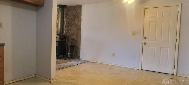 29 Elm St, Jamestown Vlg, OH 45335 - foyer featuring a wood stove and ceiling fan