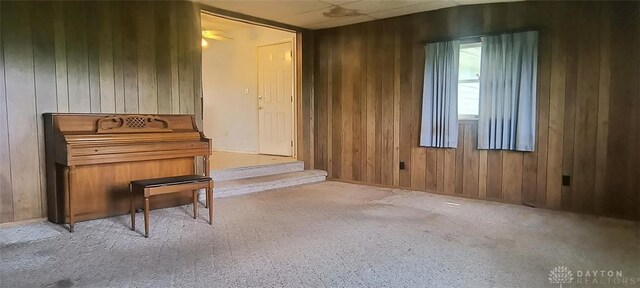 29 Elm St, Jamestown Vlg, OH 45335 - living area with wood walls and carpet floors