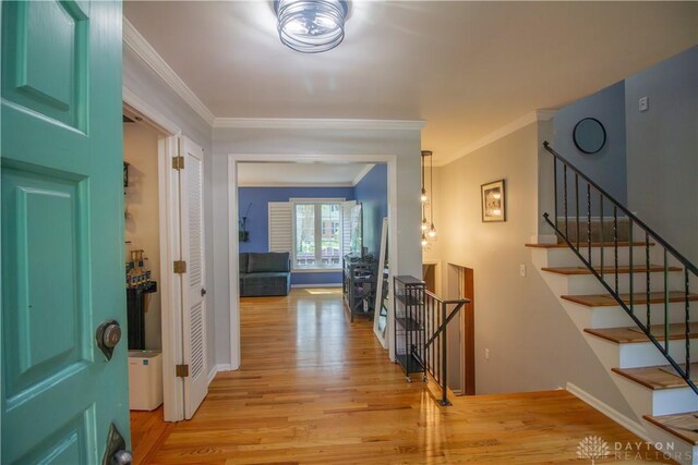101 Blue Gate Cir Unit 1, Dayton, OH 45429 - foyer entrance with light wood-style floors, crown molding, and stairs