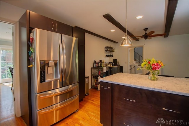 101 Blue Gate Cir Unit 1, Dayton, OH 45429 - kitchen featuring stainless steel fridge, a ceiling fan, light wood-style flooring, hanging light fixtures, and light stone countertops