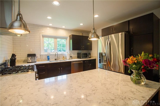 101 Blue Gate Cir Unit 1, Dayton, OH 45429 - kitchen featuring stainless steel appliances, decorative backsplash, light stone counters, decorative light fixtures, and recessed lighting