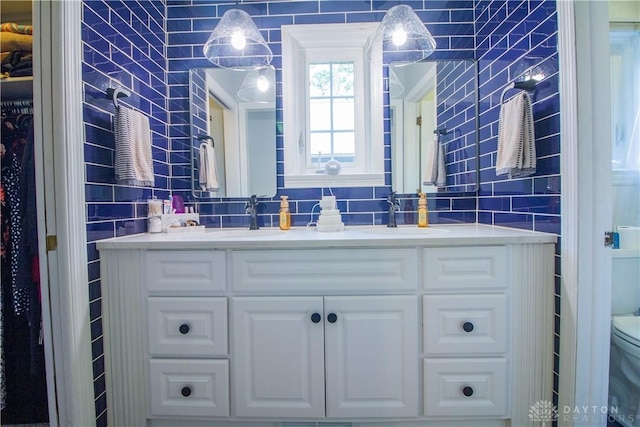 101 Blue Gate Cir Unit 1, Dayton, OH 45429 - bathroom with tile walls, double vanity, and tasteful backsplash