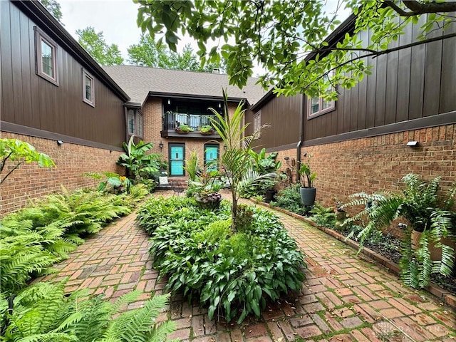 101 Blue Gate Cir Unit 1, Dayton, OH 45429 - view of exterior entry featuring brick siding and a balcony