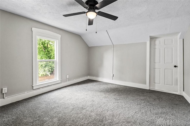 506 Virginia Ave, Troy, OH 45373 - bonus room featuring a textured ceiling, carpet floors, vaulted ceiling, and a ceiling fan