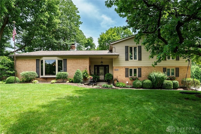 5516 Anne Ln, Washington Twp, OH 45459 - split level home with brick siding and a front lawn
