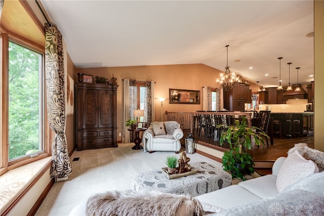 5516 Anne Ln, Washington Twp, OH 45459 - living area with vaulted ceiling, plenty of natural light, light colored carpet, and a chandelier