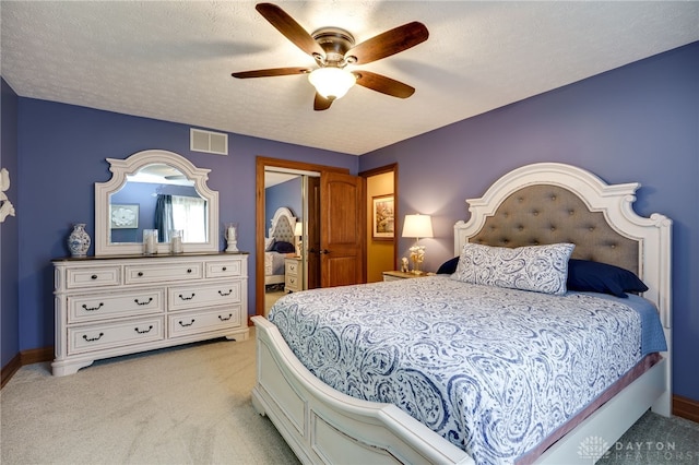 5516 Anne Ln, Washington Twp, OH 45459 - bedroom with light carpet, a ceiling fan, and a textured ceiling
