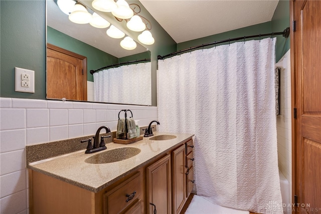 5516 Anne Ln, Washington Twp, OH 45459 - bathroom with double vanity, tile walls, and a shower with curtain