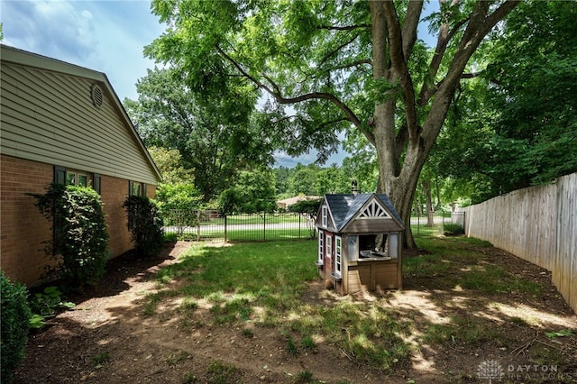 5516 Anne Ln, Washington Twp, OH 45459 - fenced backyard with an outdoor structure