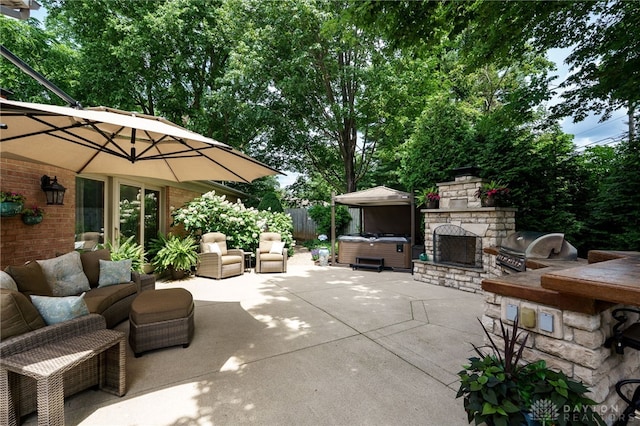 5516 Anne Ln, Washington Twp, OH 45459 - view of patio / terrace featuring a hot tub and exterior kitchen