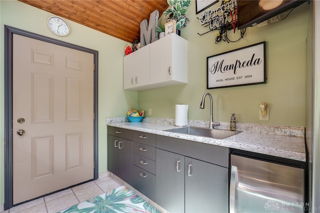 5516 Anne Ln, Washington Twp, OH 45459 - kitchen featuring wooden ceiling, light tile patterned flooring, white cabinets, stainless steel fridge, and gray cabinetry