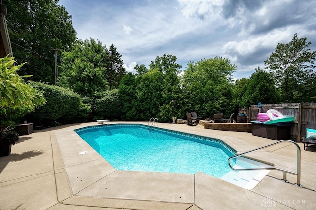 5516 Anne Ln, Washington Twp, OH 45459 - view of swimming pool with a patio, a diving board, and view of scattered trees
