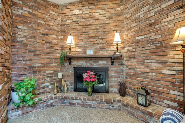 5516 Anne Ln, Washington Twp, OH 45459 - unfurnished living room featuring brick wall, a brick fireplace, and carpet floors