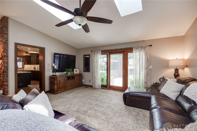 5516 Anne Ln, Washington Twp, OH 45459 - living area featuring lofted ceiling, a ceiling fan, light carpet, and a skylight