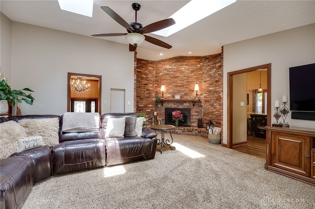 5516 Anne Ln, Washington Twp, OH 45459 - carpeted living area featuring a skylight, a fireplace, ceiling fan, and a chandelier