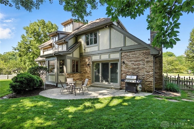 1101 Fox Chase Ct, Centerville, OH 45459 - rear view of house with stucco siding, a patio, and brick siding