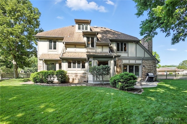 1101 Fox Chase Ct, Centerville, OH 45459 - back of house featuring a chimney, a patio, brick siding, a shingled roof, and stucco siding