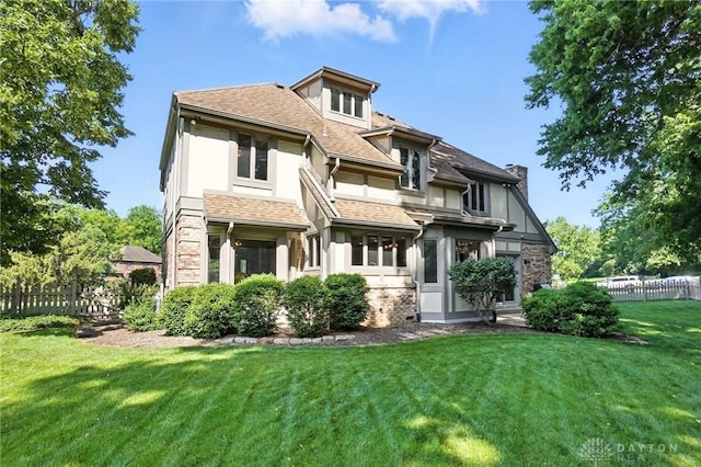 1101 Fox Chase Ct, Centerville, OH 45459 - rear view of house with stucco siding, roof with shingles, and a chimney