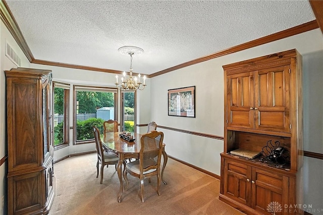 1101 Fox Chase Ct, Centerville, OH 45459 - dining room with a chandelier, light carpet, crown molding, and a textured ceiling