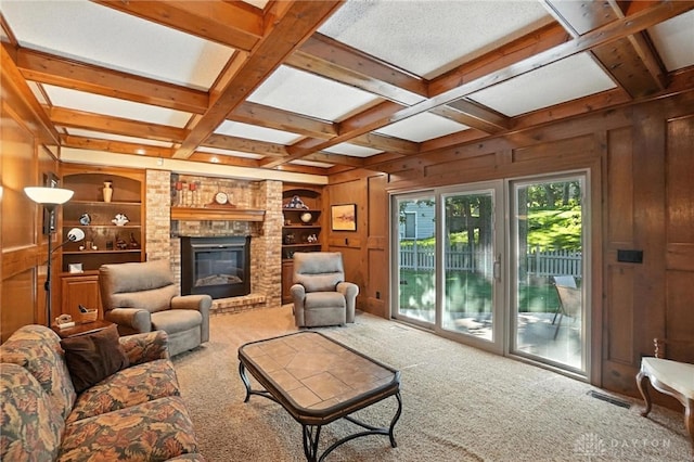 1101 Fox Chase Ct, Centerville, OH 45459 - carpeted living room featuring wood walls, coffered ceiling, beamed ceiling, built in shelves, and a fireplace